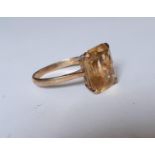A 9ct gold ring with large square cut citrine cabochon, stamped 375, total weight 2.83g