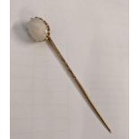 A gold coloured stick pin set with an opal, 2.3g Location: