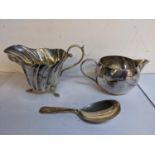 Mixed silver to include two cream jugs together with a caddy spoon, 139.1g Location: