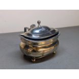 An early 19th century, large silver lidded condiment pot with handle and blue glass liner, on ball