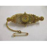 A Victorian 18ct gold brooch inset with a diamond and attached safety chain 4.7g Location: