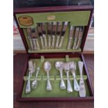 A Viners silver plated six-place canteen of cutlery contained in a mahogany finished case (one