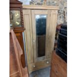 An early 20th century pine wardrobe with a mirrored door and a drawer, 190cm h x 84cm w Location: