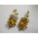 A pair of yellow metal earrings inset with citrine's, 4.1g Location: