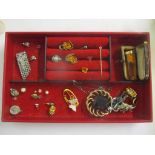 A mixed lot of jewellery to include a yellow metal stick pin, amber cheroot holder and other items