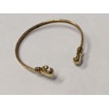 A gold coloured bracelet with boxing glove terminals tested as 9ct 9g Location: