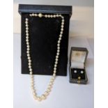 A pearl necklace and a pair of pearl earrings each cased Location: