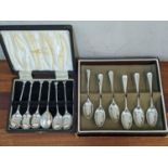 A set of six seal terminal teaspoons, and a set of six silver Old English pattern teaspoons