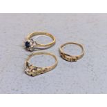 A group of three rings to include a 9ct gold example having a central diamond and heart shaped