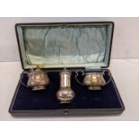 An early 20th century Walker & Hall boxed three piece silver cruet set, 188.8g Location: