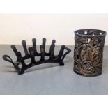 An early 20th century silver toast rack together with a pierced engraved silver condiment surround