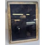 A late 20th century silver photograph frame on an easel back, 20.5cm x 15.5cm Location: