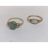 Two 9ct gold rings, one set with opal 1.5g, and one other inset with two diamonds and a green