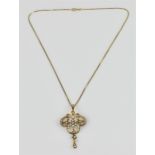 An Edwardian 15ct yellow gold, pearl and diamond pendant/brooch, with central pearl flower with a
