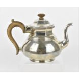 A George V silver teapot by William Comyns & Sons Ltd , London 1932, retailed by Asprey of London,