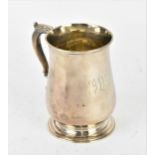 An early George III silver tankard, London 1765, makers initials F.M, of baluster form with acanthus