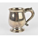 A George V silver tankard by GM & S, Sheffield 1933, of baluster form with leaf mounted scroll