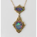 A Victorian 9ct yellow gold and black opal necklace, the two part pendant with two central oval
