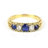 A yellow metal, diamond and sapphire five stone ring, with graduated and alternating diamond and