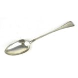 A Victorian silver basting spoon by William Eaton, London 1844, with thread handle and engraved