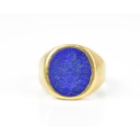 A yellow metal and lapis lazuli gentlemen signet ring, with full impressed heraldic cameo, size T