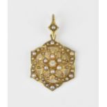 An Edwardian 15ct yellow gold, seed pearl and diamond pendant, modelled as interlaced hoops with