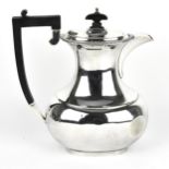 A George V silver coffee pot by Barker Brothers Silver Ltd, Birmingham 1934, of baluster form with
