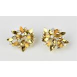 A pair of 18ct yellow gold and diamond cluster earrings, each set with ten brilliant cut diamonds in