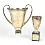 An early 20th century French silver twin-handled ski trophy by Cartier, with scroll handles either