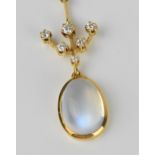 An 18ct yellow gold, diamond and moonstone pendant, set with a single oval cabochon moonstone in a