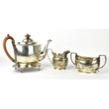 A George III silver teapot, stand and milk jug by William Bennett, London 1802 and 1803, the