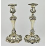 A pair of George V silver candlesticks by Roberts & Belk Ltd, Sheffield 1930, in the Roccoco taste