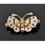 An 18ct yellow gold, diamond, ruby and emerald brooch of a butterfly, modelled naturalistically with