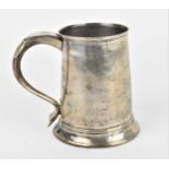 A George III silver tankard, London 1783, makers marks partially rubbed, of cylindrical tapered form