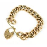 A 9ct rose gold Cuban chain bracelet, with heart locket clasp and safety chain, weight 25.6 grams