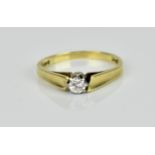 AN 18ct yellow gold and diamond solitaire ring, the brilliant cut diamond in an eight claw white