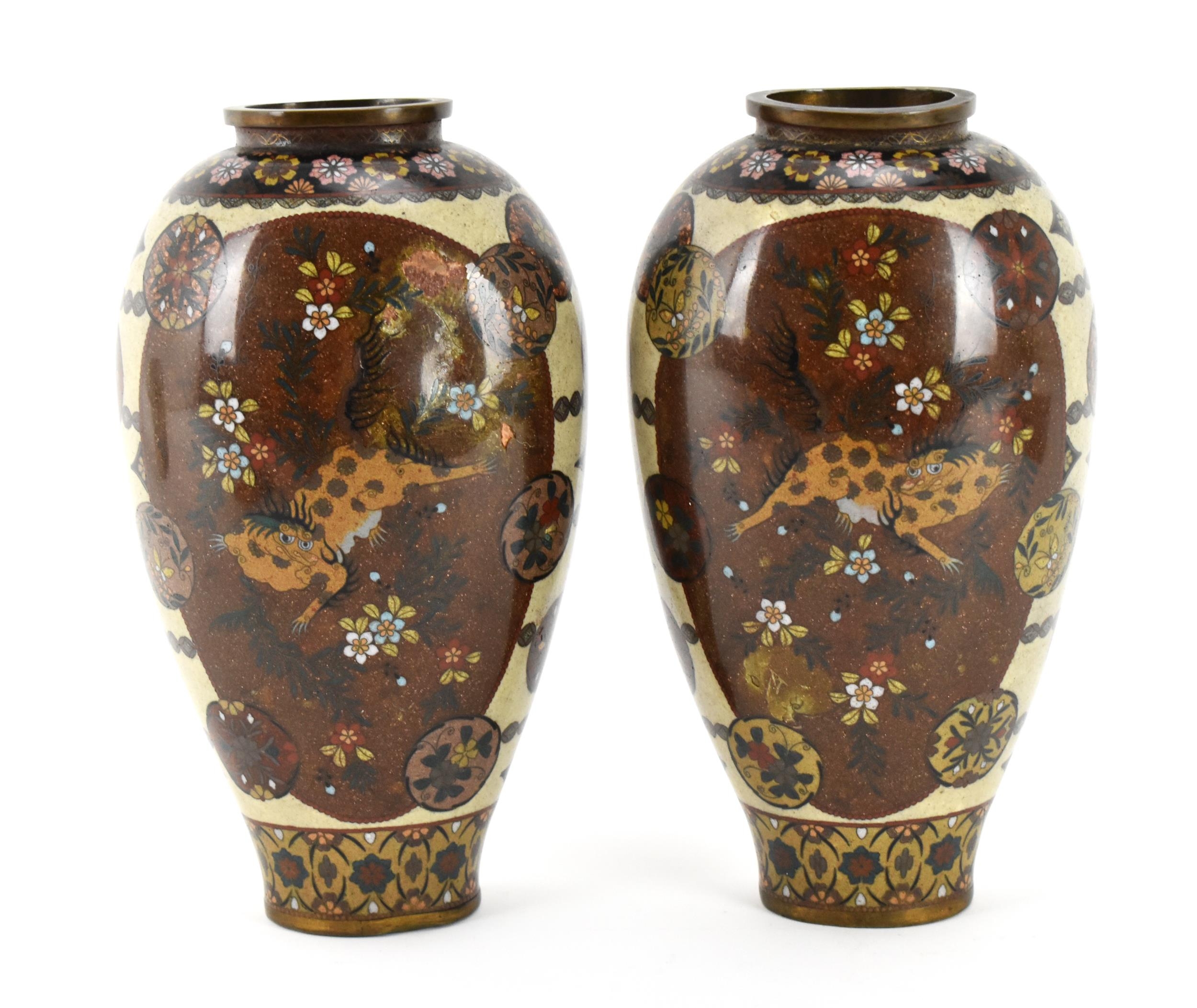 A pair of Japanese Meiji/Taisho period cloisonne enamel vases, each with central goldstone ground