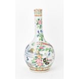 A Chinese Famille Rose porcelain bottle vase, late 19th century, with underglaze blue landscape