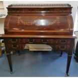 An Edwardian inlaid mahogany cylinder desk, with cast brass gallery, over three inlaid drawers,