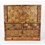 A Japanese Meiji period miniature tansu parquetry cabinet, with tambour sliding front doors