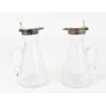 A pair of Edwardian silver mounted glass whisky tots by Mappin & Webb, of cylindrical tapered form