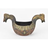 A 19th century Norwegian 'Kasas' or ale bowl, made of wood, carved with horse head either side,