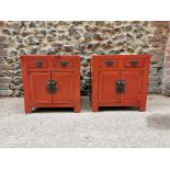 A pair of Chinese red lacquer bedside cabinets, early 20th century, of square form with two small