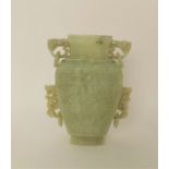 A Chinese celadon jade taotie vase