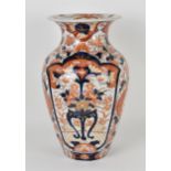 A Japanese Imari porcelain baluster vase, with everted rim, the body decorated with two large panels
