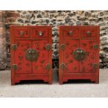 A pair of Chinese red lacquer bedside cabinets, early 20th century, each with two small drawers