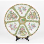 A large Chinese Canton export porcelain charger, 19th century, in the famille rose palette, of