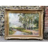 Alois Arnegger (1879-1963) Austrian depicting a woodland riverside scene, signed lower right, oil on