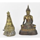 A Sino-Tibetan bronze figure of the Buddha Shakyamuni, seated in Padmasana with his right hand in