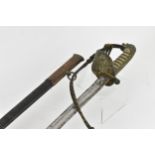 An 1827 pattern Royal Navy Officers sword and scabbard having lion head pommel and folding guard,